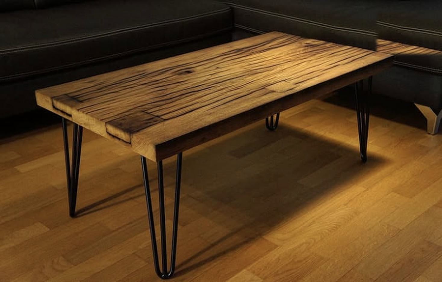 Oak coffee table with black-filled checks and a patched end, on black hairpin legs